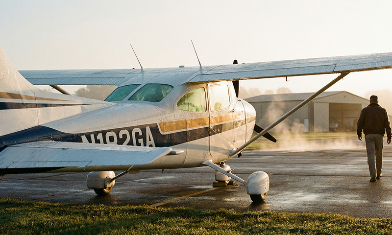 General aviation aircraft at sunrise with visible tail number, representing the passion behind TailNumberGear