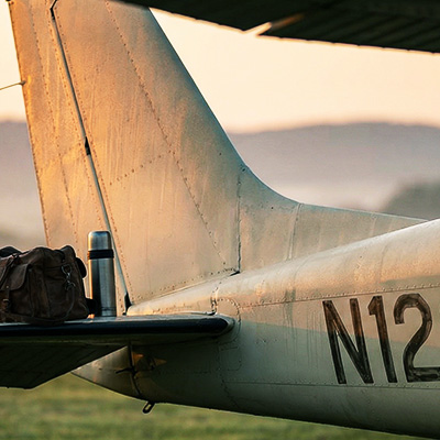 General aviation aircraft tail at sunrise with visible tail number, representing the passion and lifestyle of pilots and aviation enthusiasts