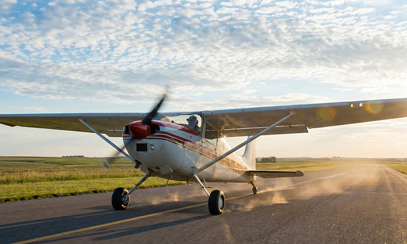 General aviation airplane taxiing toward the runway, symbolizing freedom and the journey ahead in aviation